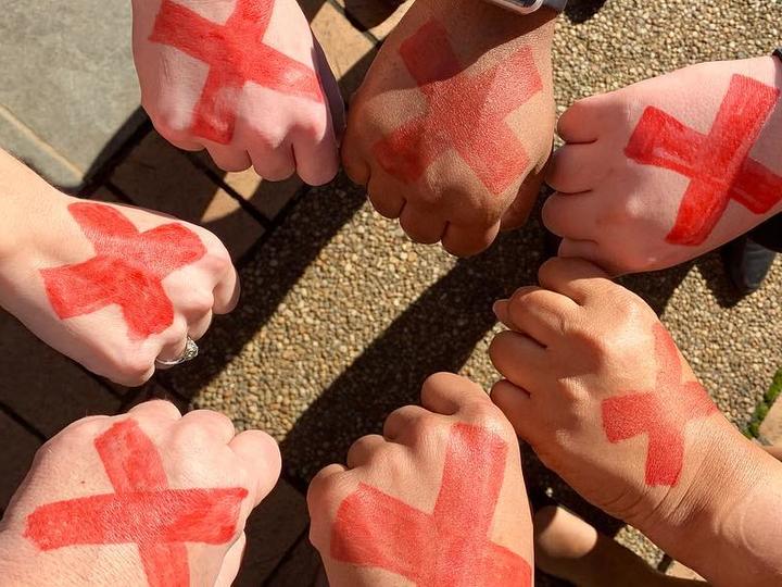 Human trafficking red X