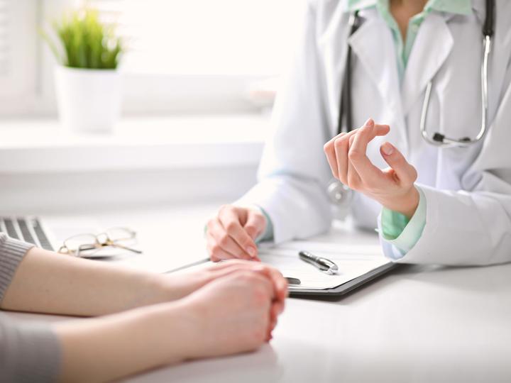 Physician consulting with a patient